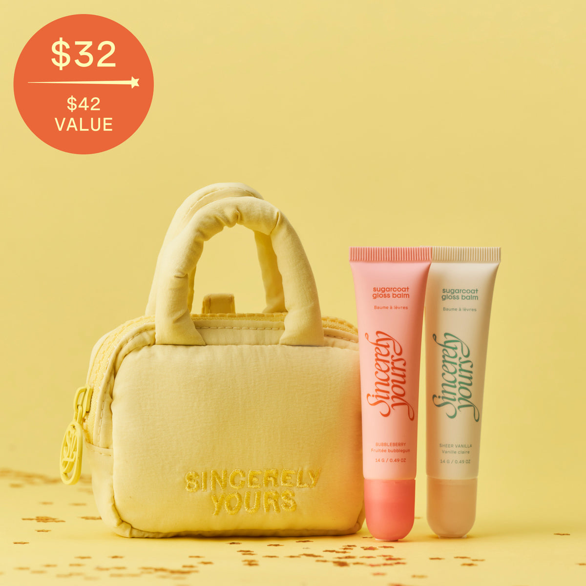 The Gloss To Go Set, two gloss balms with the mini cloud case keychain, $32 / $42 value