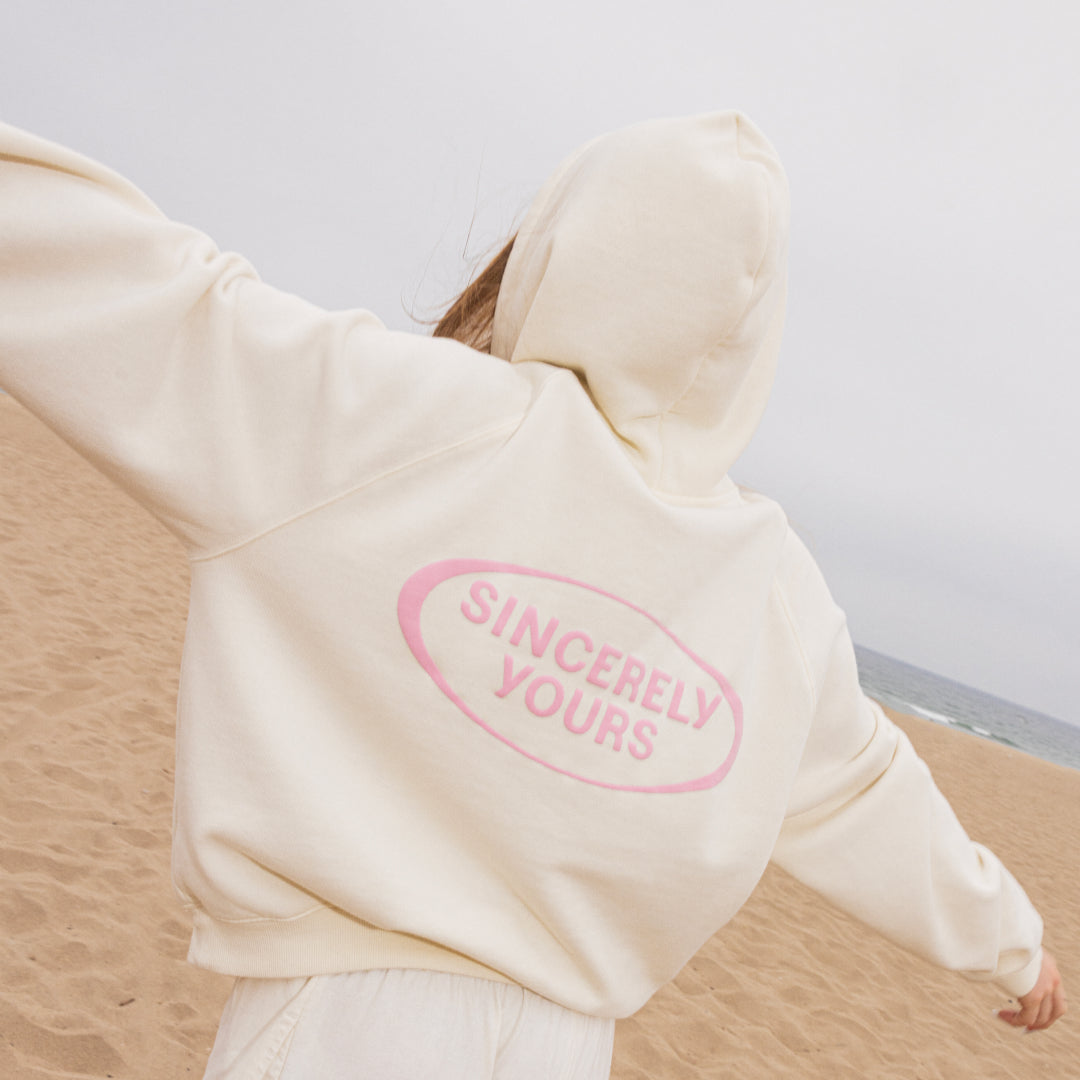 XS | S | M | L | XL | XXL |Beige hoodie with 'Sincerely Yours' text on a neutral background